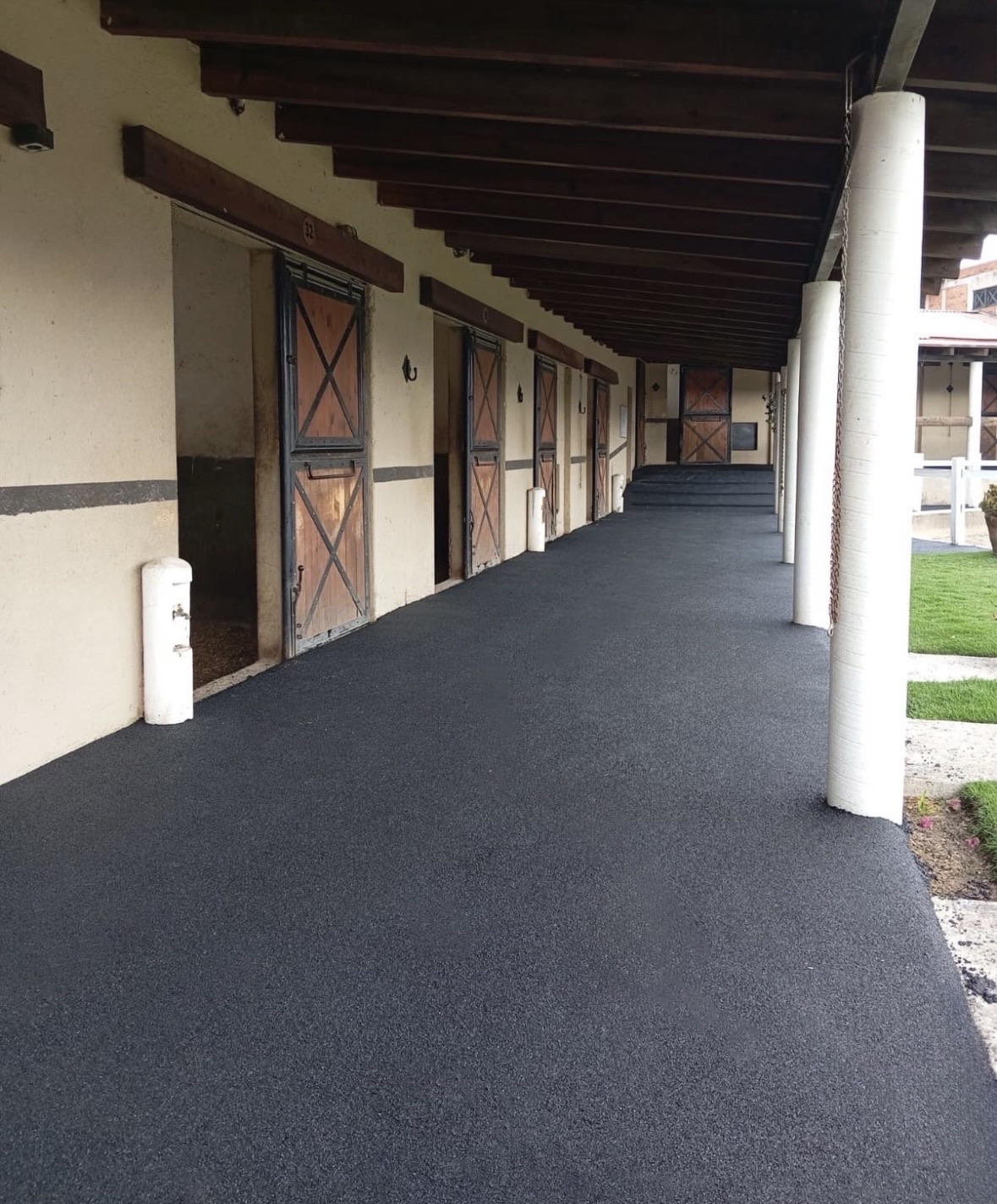 Rubber walkway through an equestrian stable.