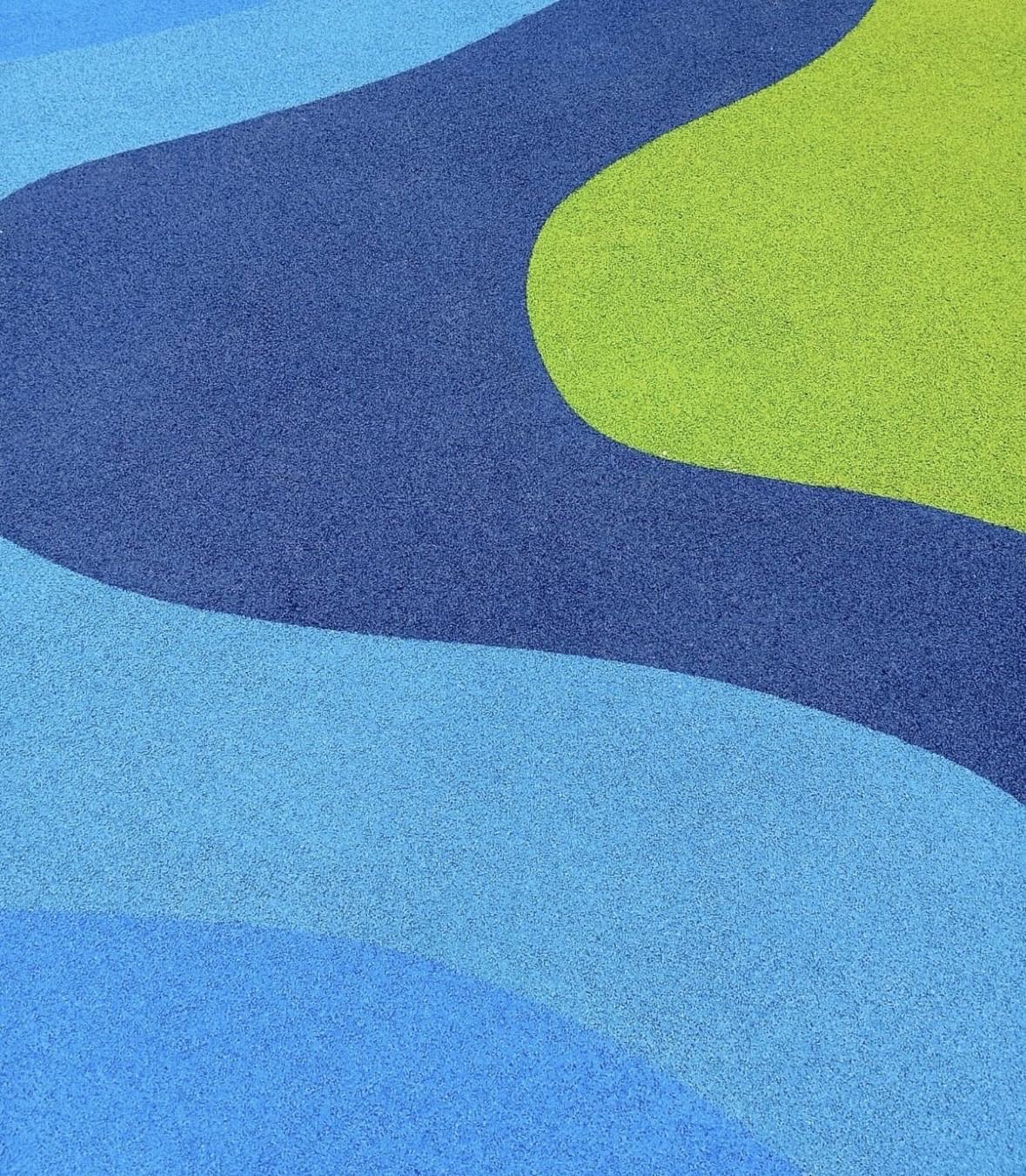 Close detail of a colored poured rubber surface.