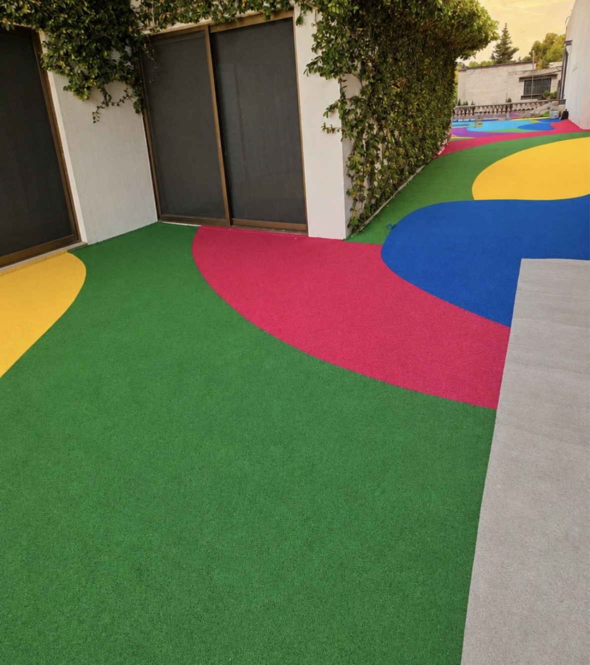 Colorful rubber surfacing in a school courtyard.